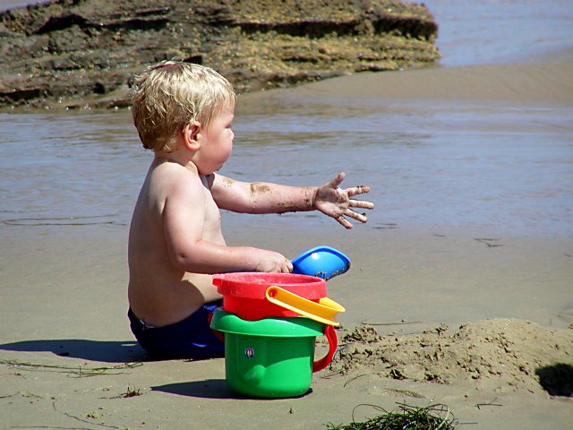 Timothy plays in the sand