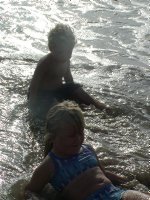 Both kids in the water