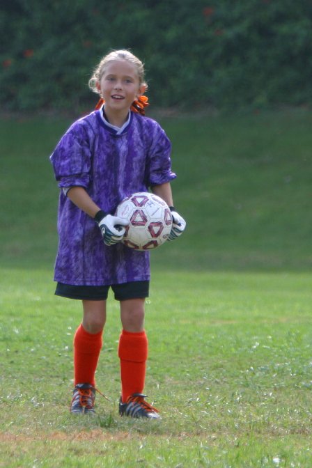 Tiger goalie Courtney with the ball