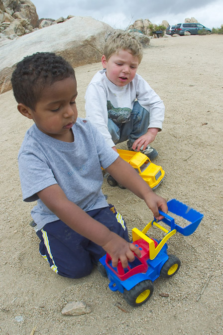 Miles and Timothy playing with trucks