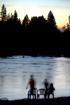 Rafting on the South Fork of the American River: Blurred riverbank family