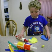 Timothy playing with modeling clay