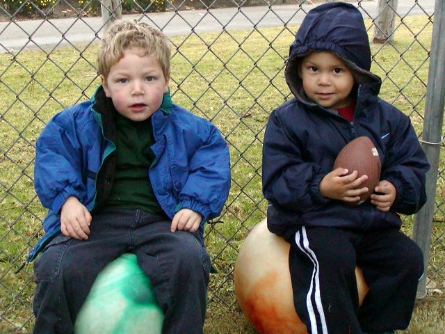Tim and Nate sit on the big balls