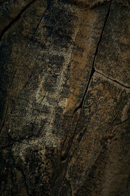 Petroglyph And Rock Cracks