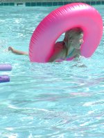 Sara in the pink pool tube