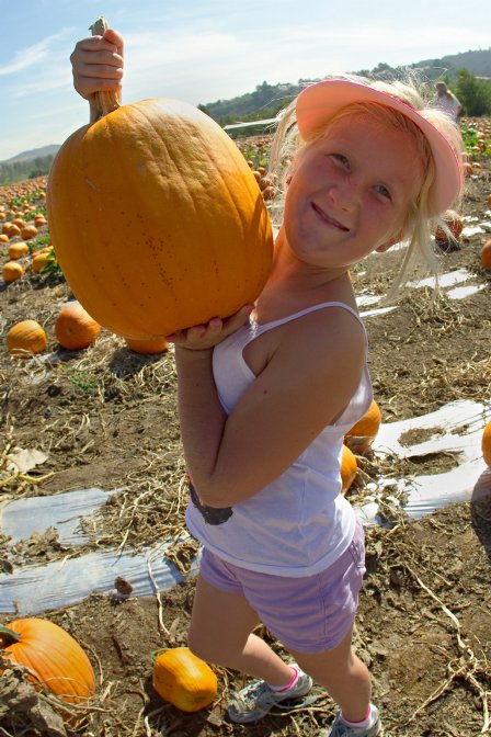 Sara with a pumpkin