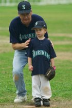 Jacob gets some coaching at the pitcher's mound
