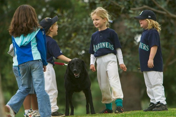 The kids get distracted from the game by Kiley's dog, Murphy