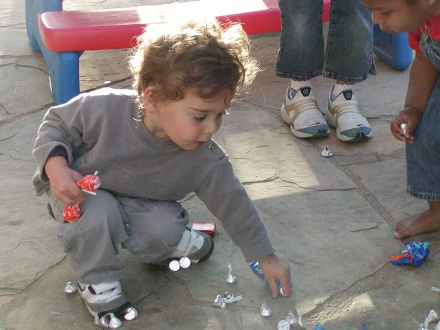 Reuben collecting piñata candy